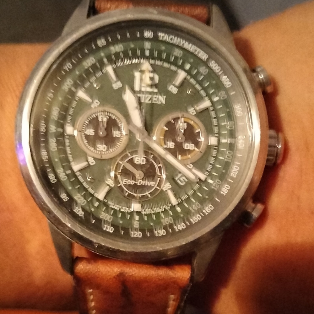 Citizen Eco Drive Tachymeter watch. Leather band,green face,white numerals